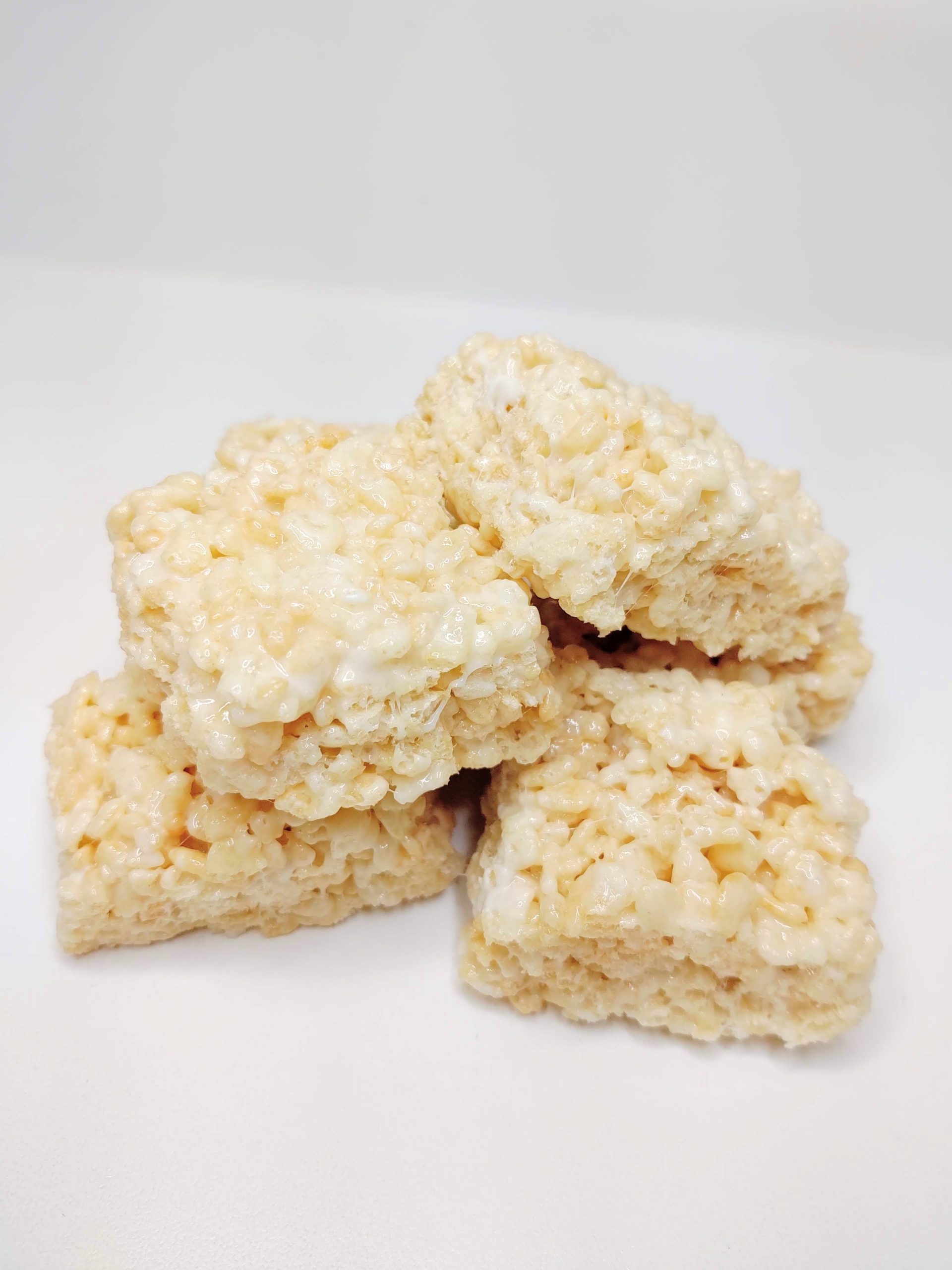 Rice Krispie Treats stacked on a counter