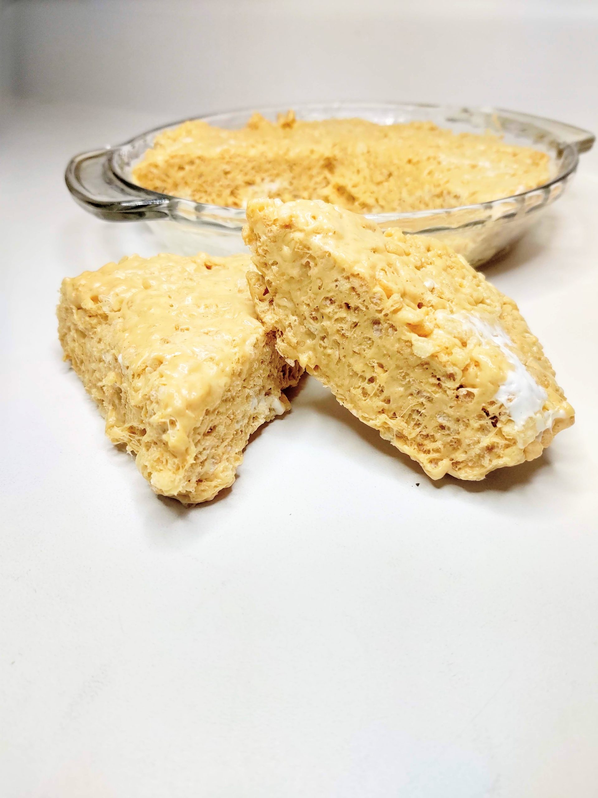 Peanut Butter Rice Krispie Treats on a white surface