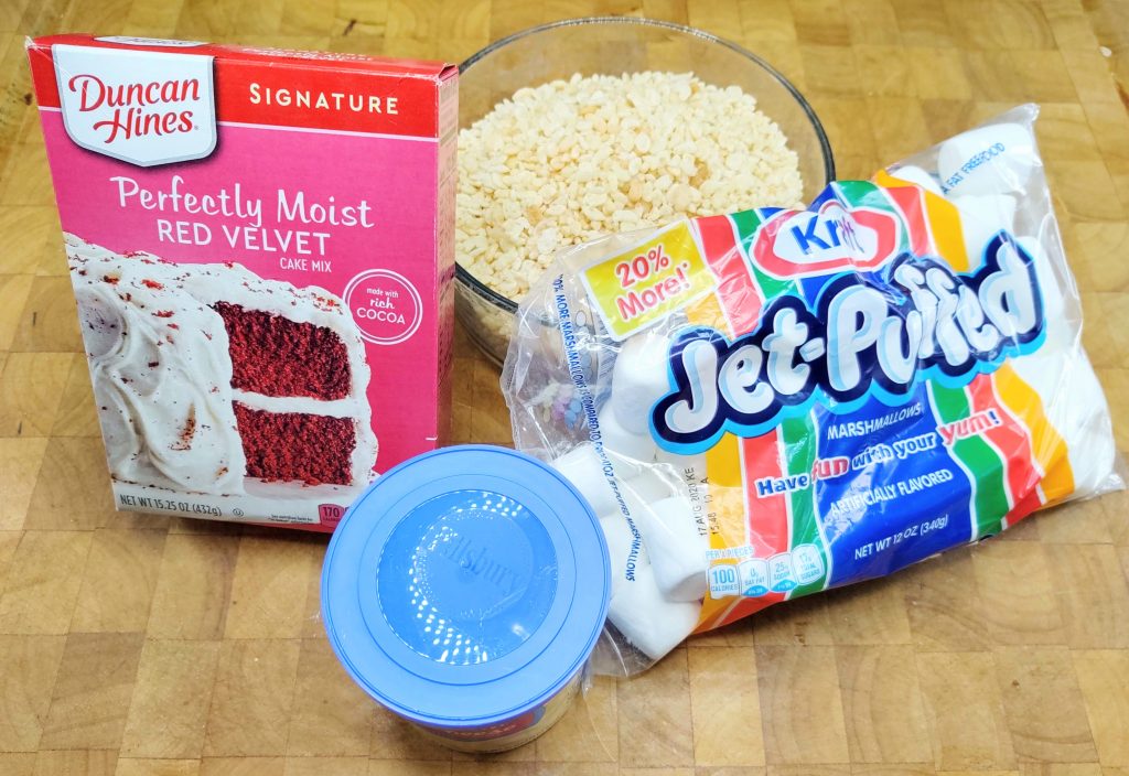 ingredient picture (clockwise from left): Red Velvet Cake Mix, Rice Krispies, marshmallows, Icing
