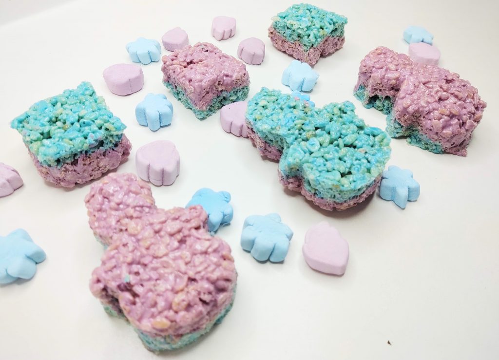 Snowman and square shaped blue and purple rice krispie treats. Blue snowflake and purple snowman head shaped marshmallows.