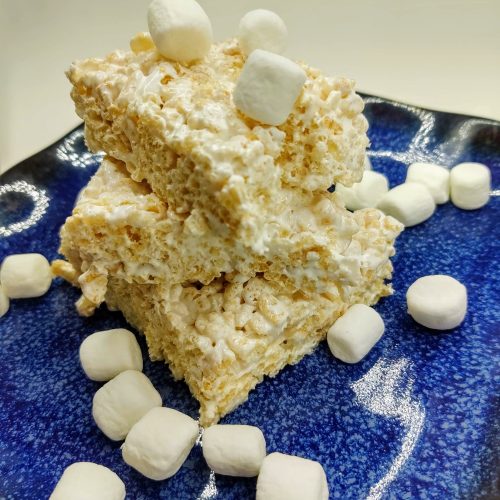 closeup of marshmallow fluff rice krispie treats surrounded by mini marshmallows