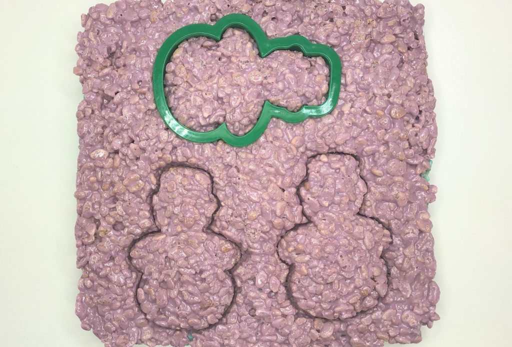 purple layer of rice krispie treats with snowman cookie cutter