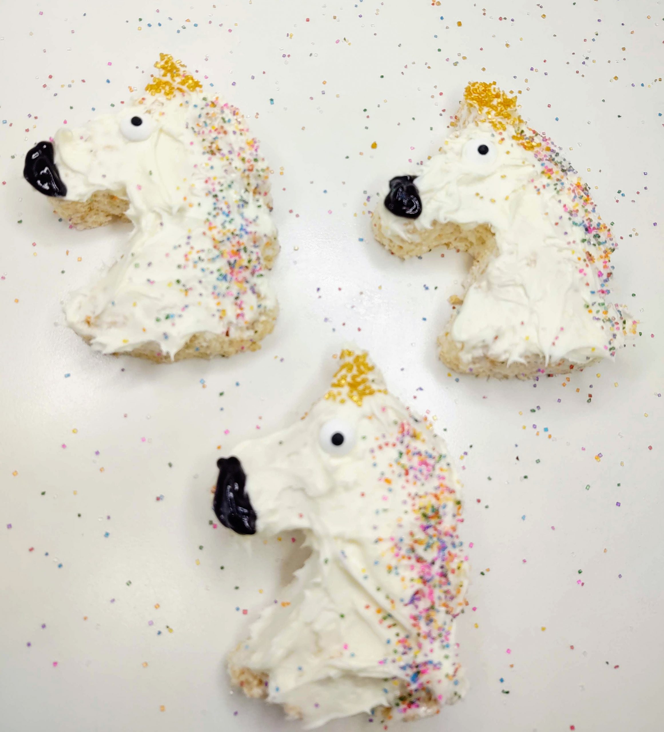 3 fully decorated unicorn rice krispie treats
