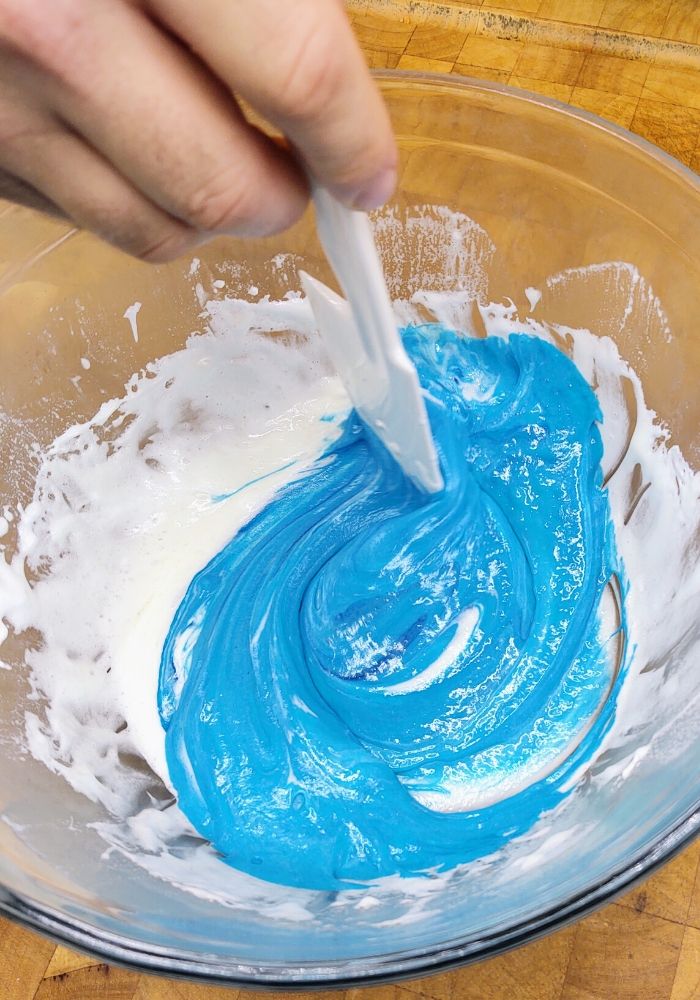 blue food coloring in melted marshmallows