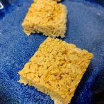 three gold rice krispie treats