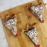 three reindeer rice krispie treats on a cutting board