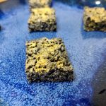 closeup of black and gold rice krispie treat