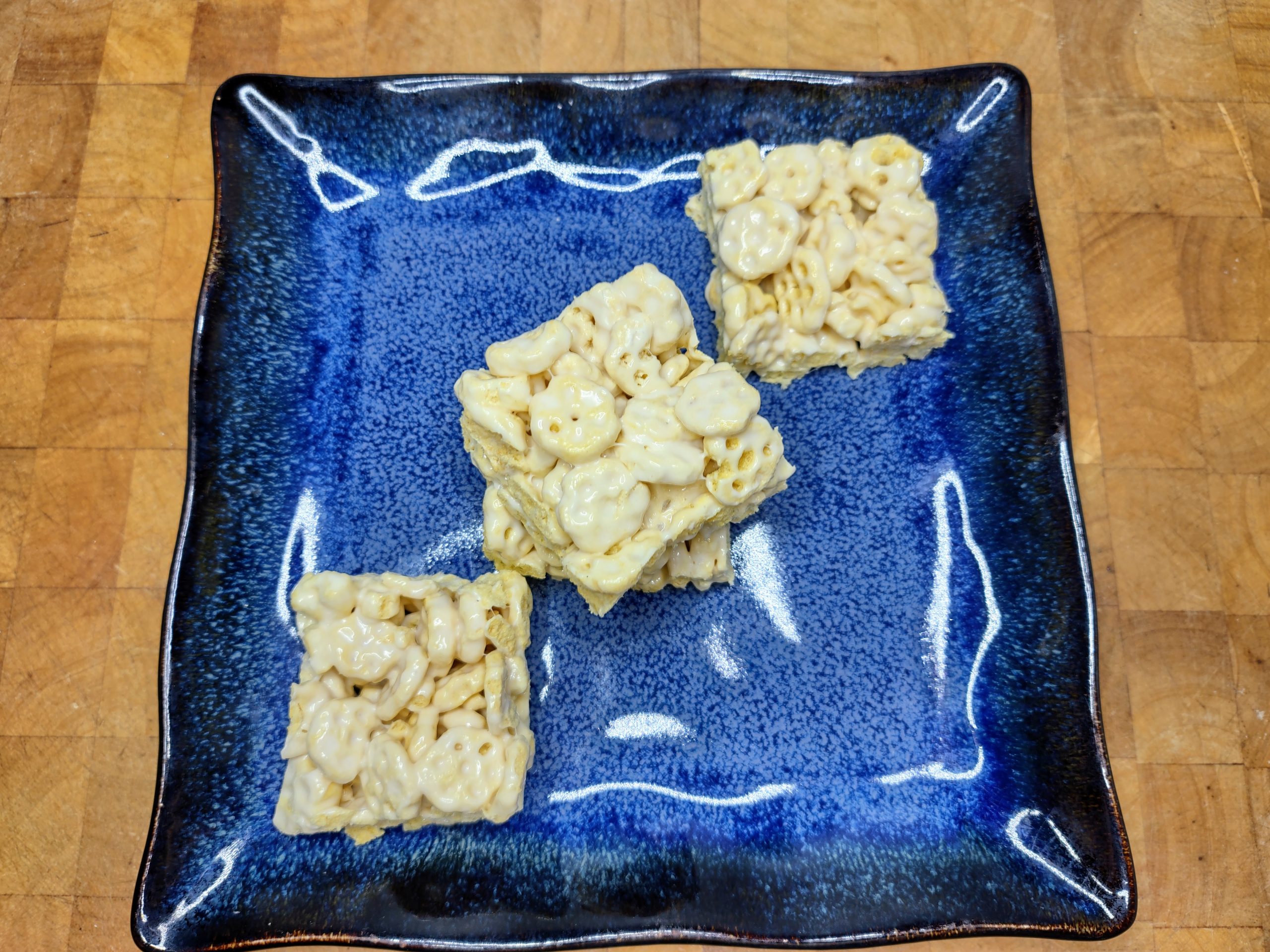 line of honeycomb treats on a blue plate