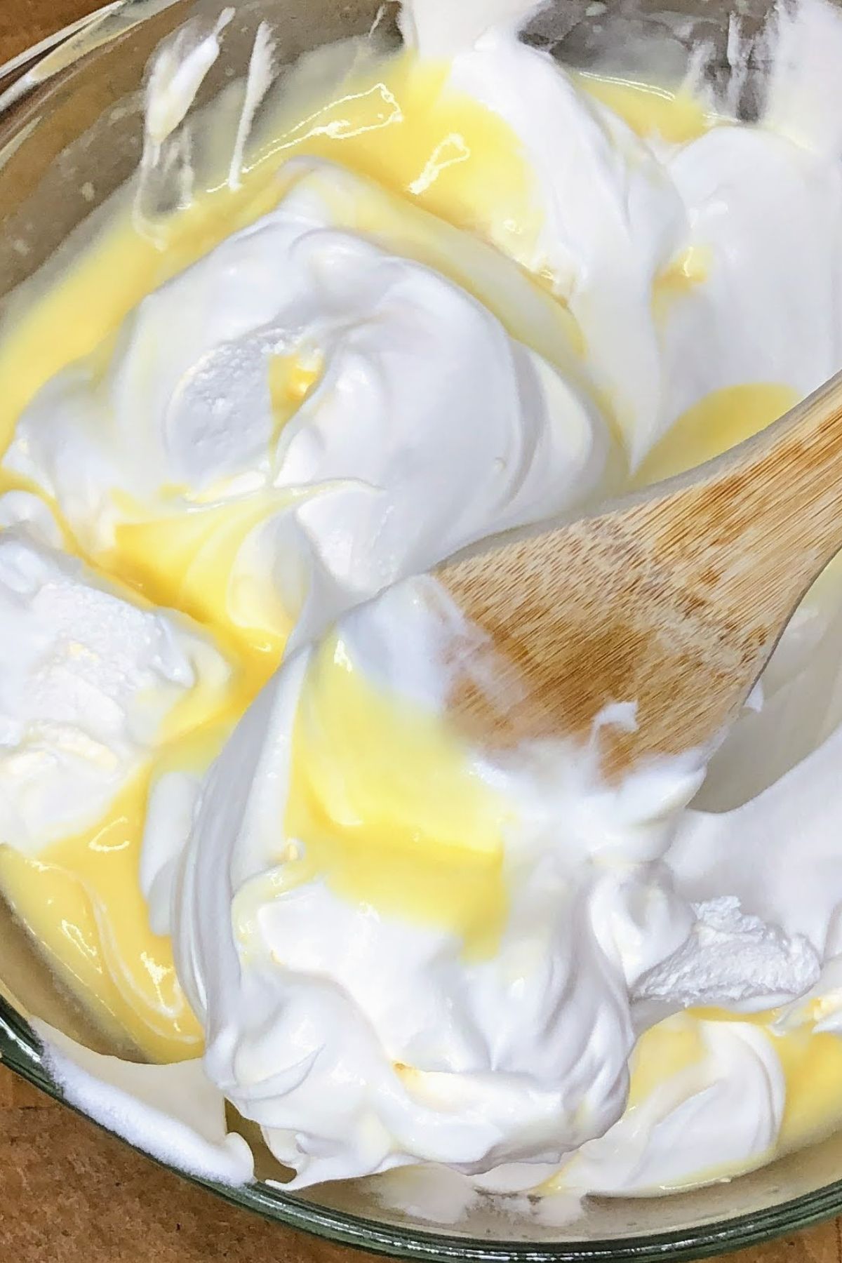 Stirring whipped topping into fluff.