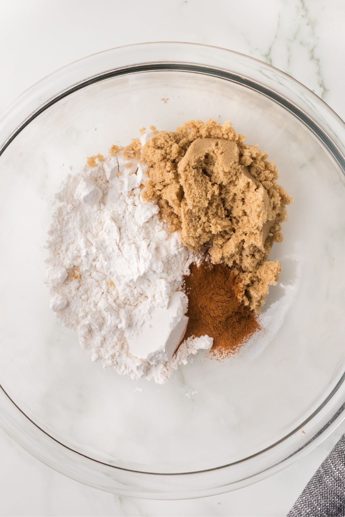 Ingredients for crumble topping in a glass bowl.