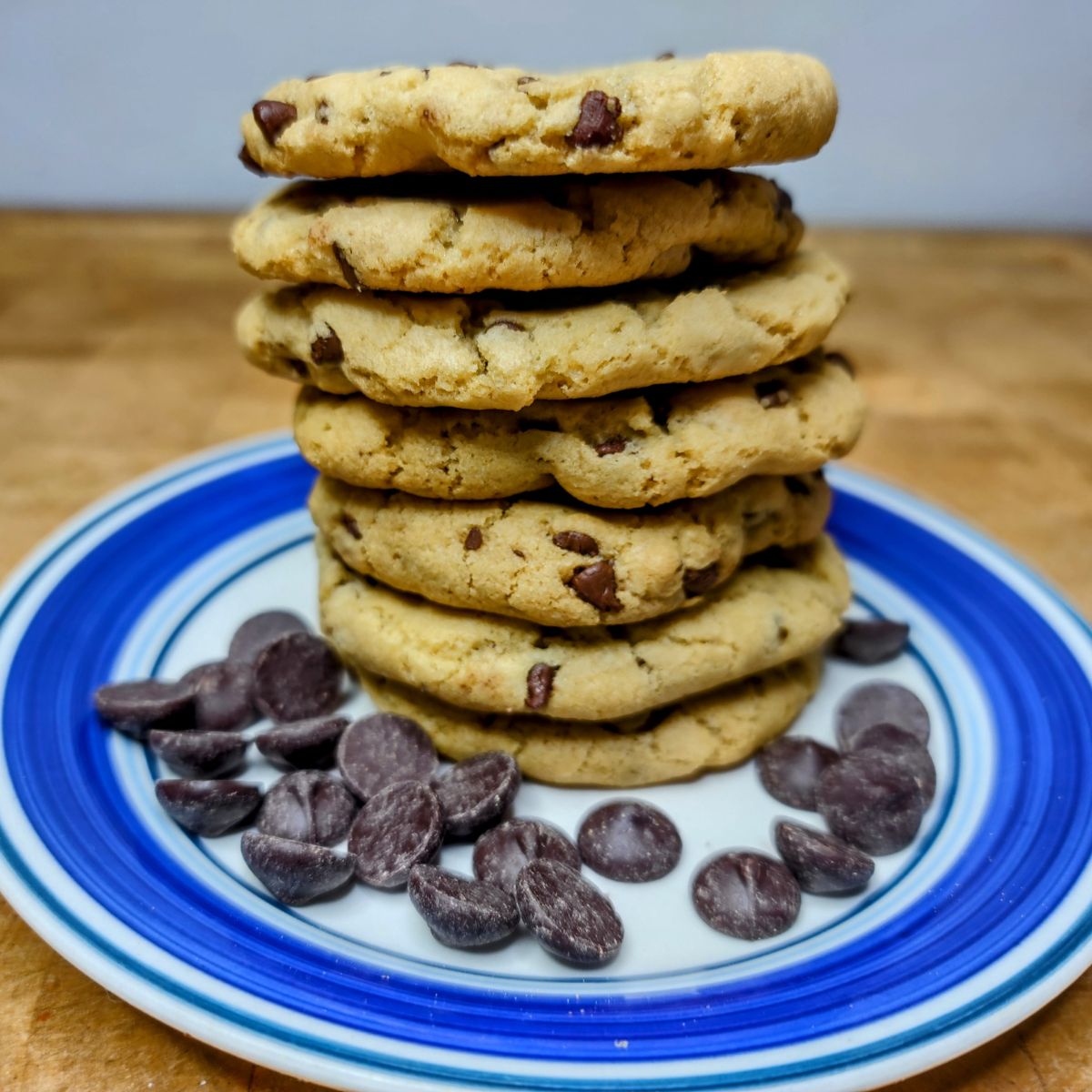 Chocolate chip cookies without butter stacked on a plate.