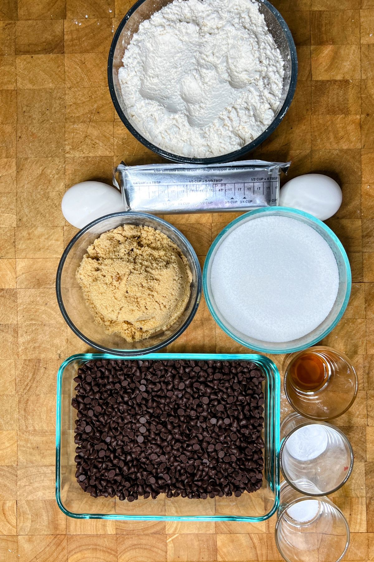 Crisco chocolate chip cookie ingredients on a wooden table.