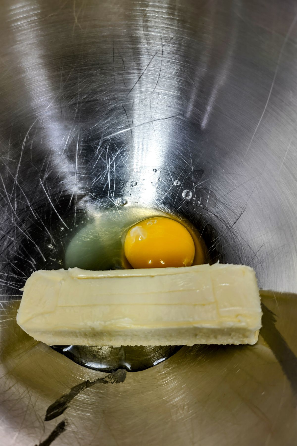 Butter and eggs in a mixing bowl.