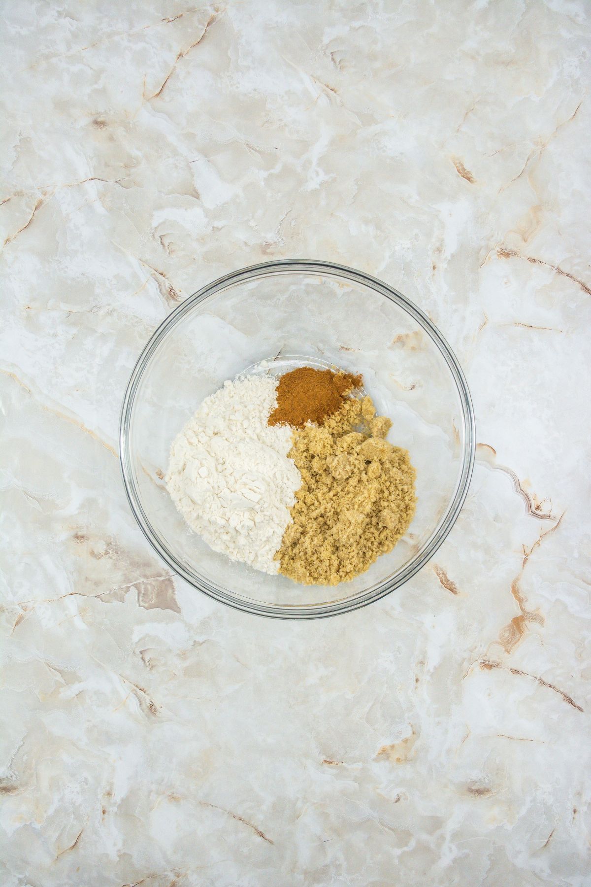 Dry ingredients for crunch topping in a mixing bowl.