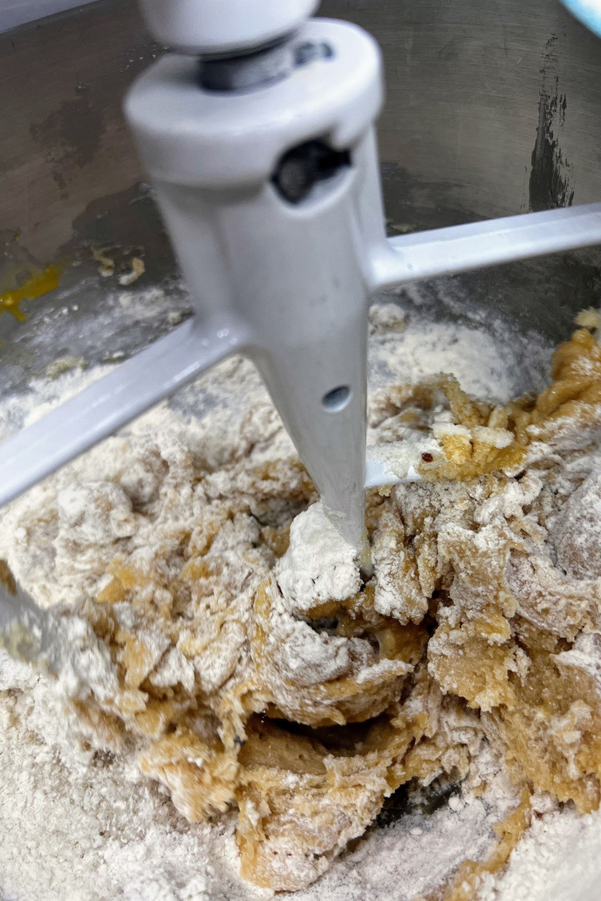 Mixing flour into cookie dough.