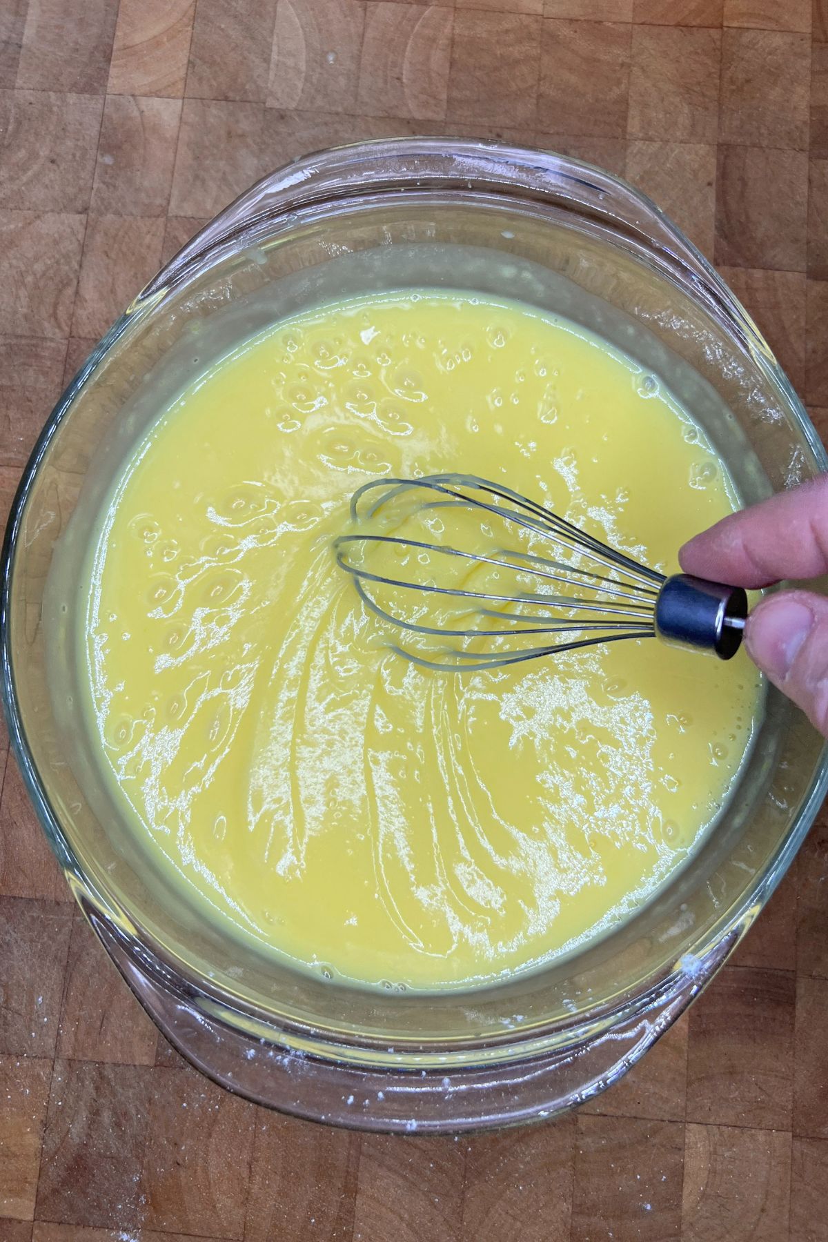 Stirring up lemon pudding.