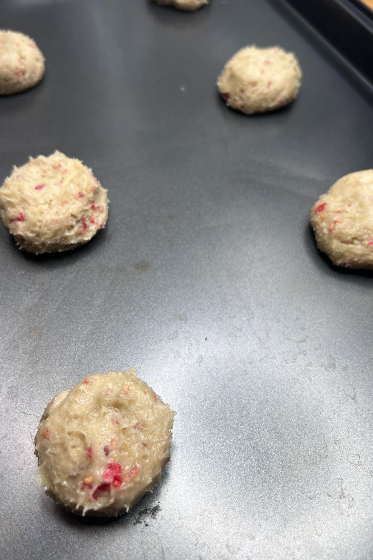Lemon raspberry cookie dough on a baking sheet.