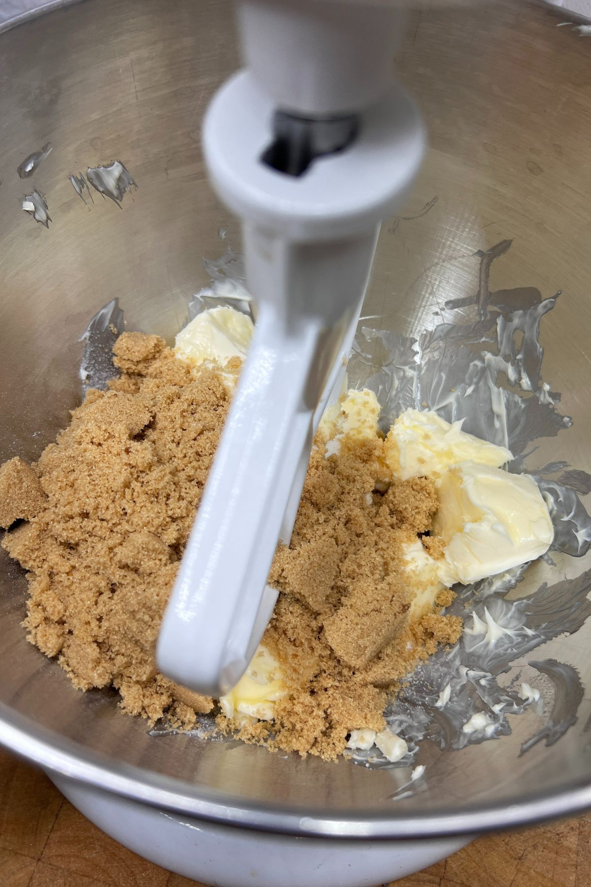 Sugar and softened butter in a mixing bowl.