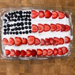 American flag cake on a wooden table.