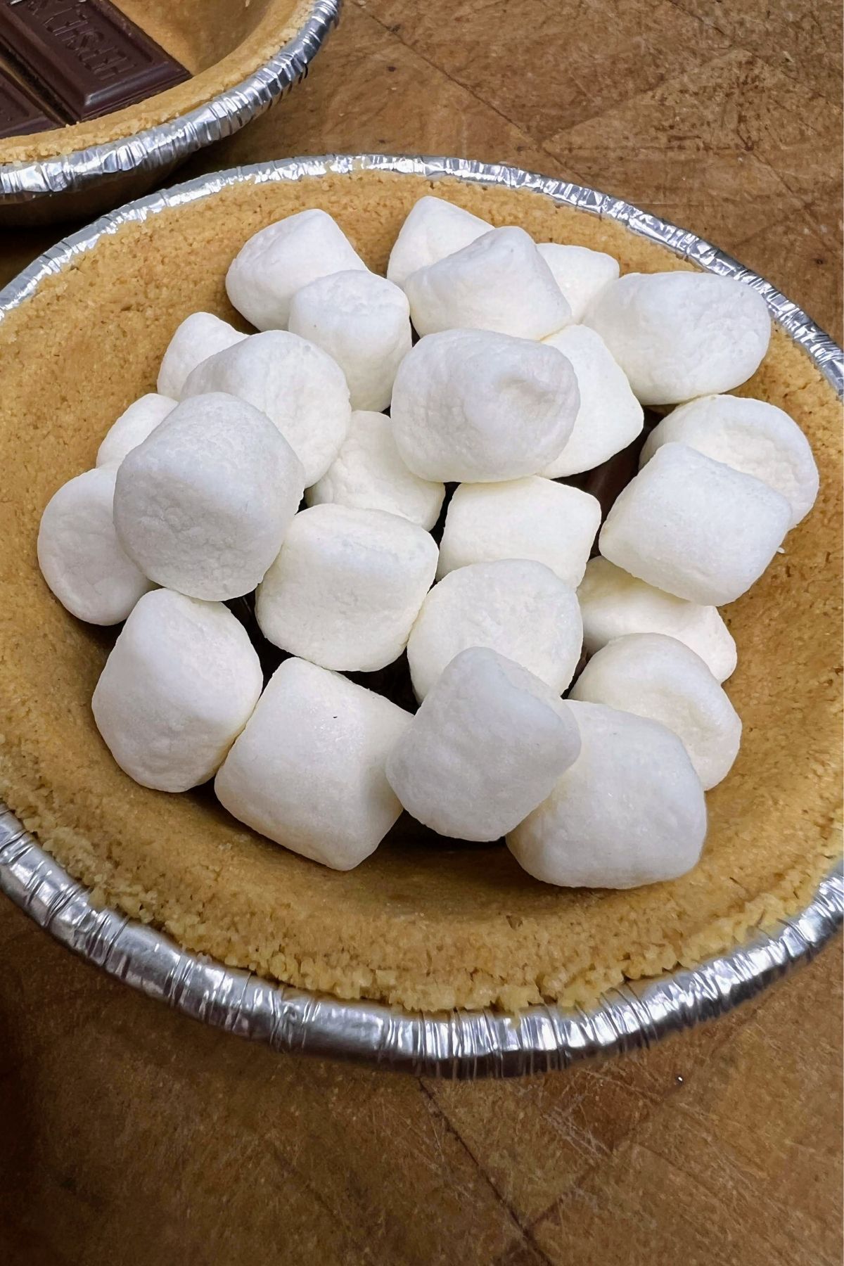 Mini marshmallows in a graham cracker crust.