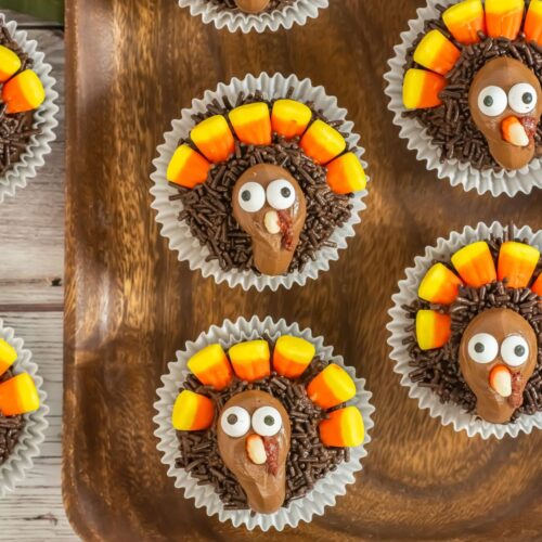 Turkey cupcakes on a wooden board.