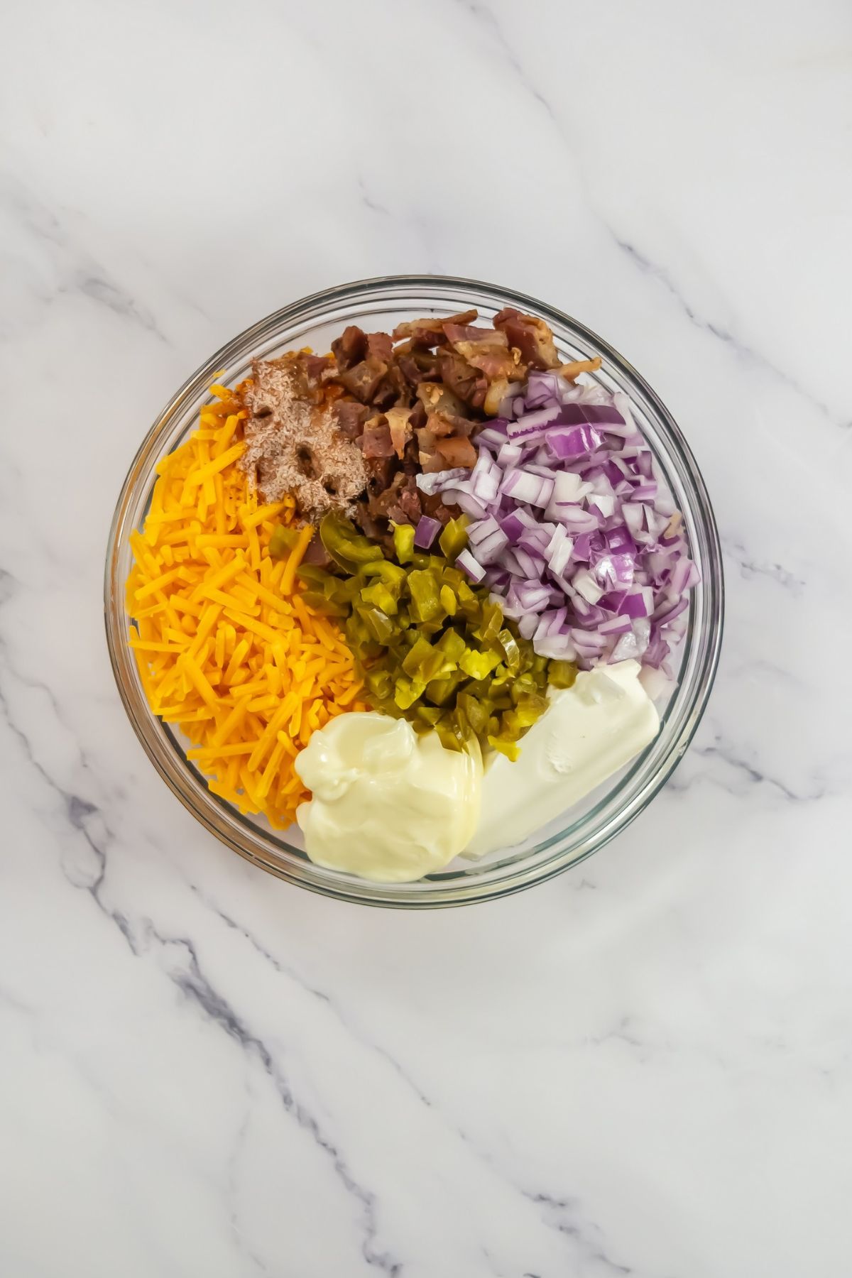 Chopped ingredients in a mixing bowl.