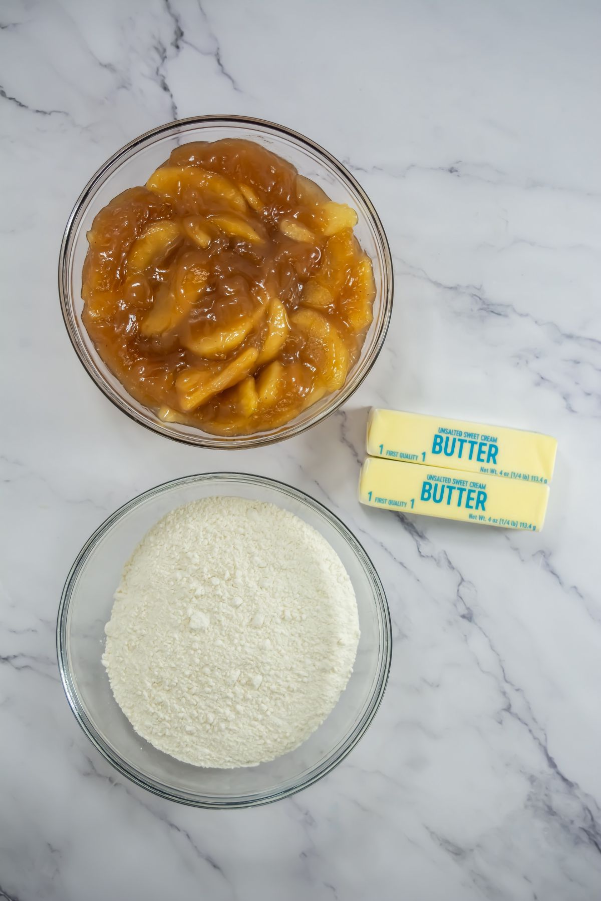 Apple dump cake ingredients on counter.
