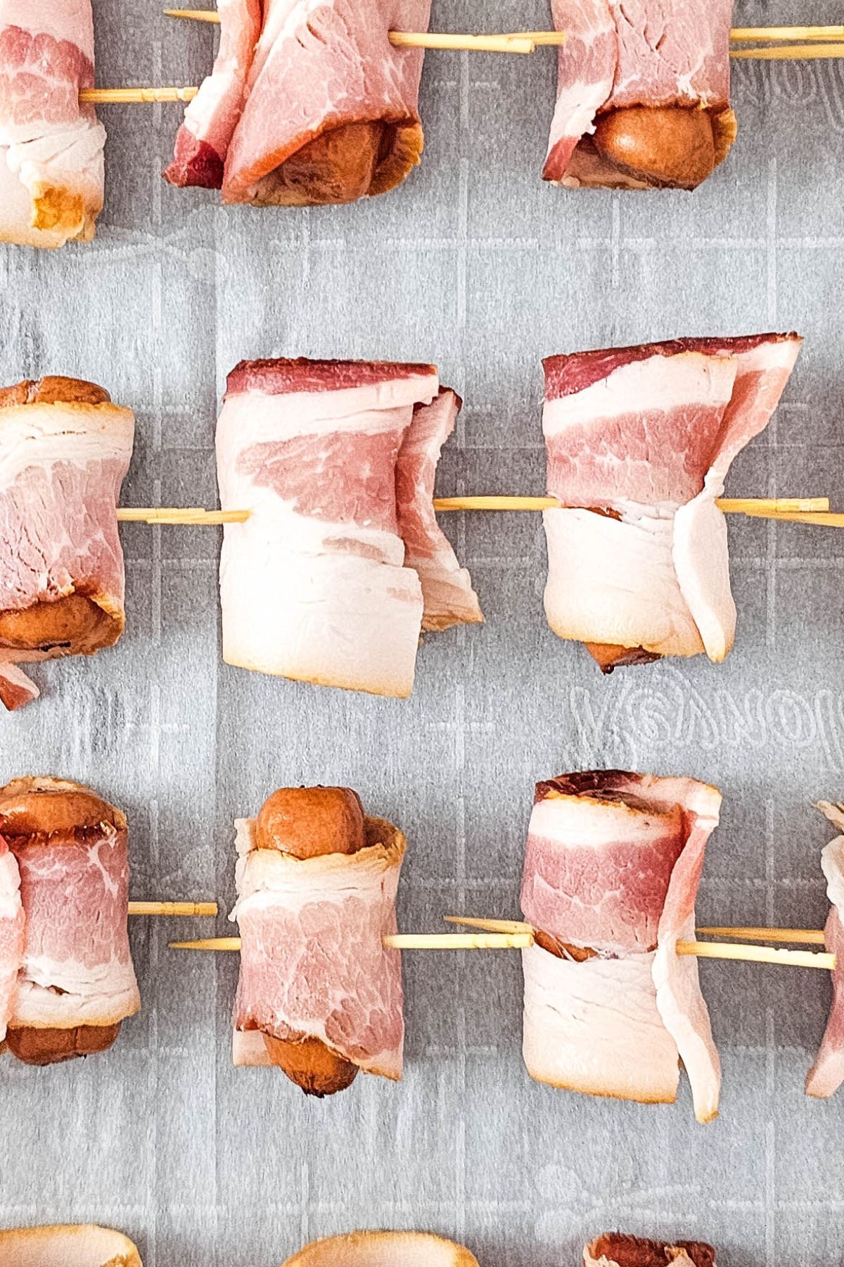Toothpicks through bacon wrapped smokies.