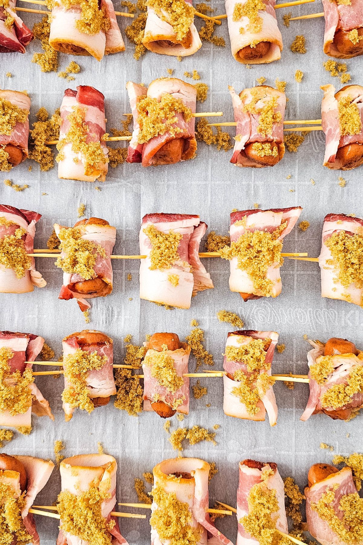 Toothpicks through bacon wrapped smokies.