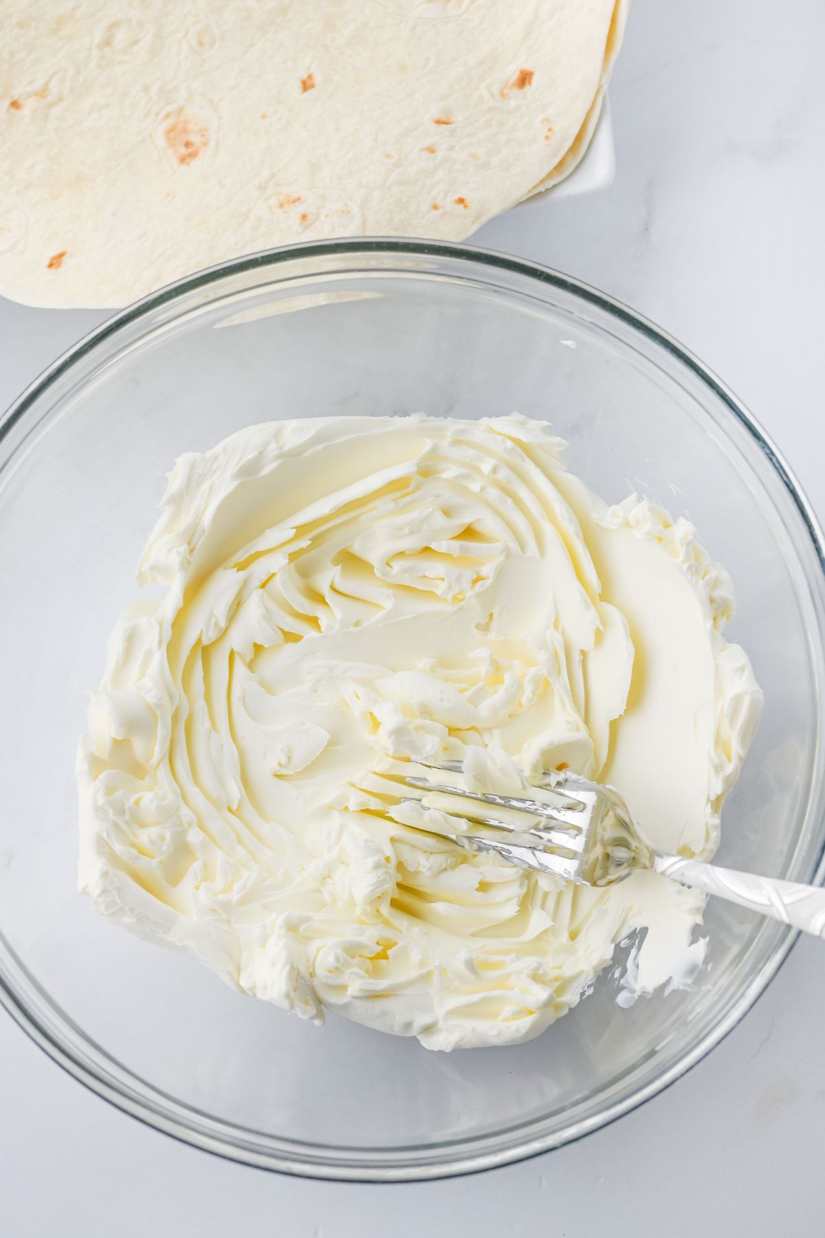 Cheese all whipped in a bowl.