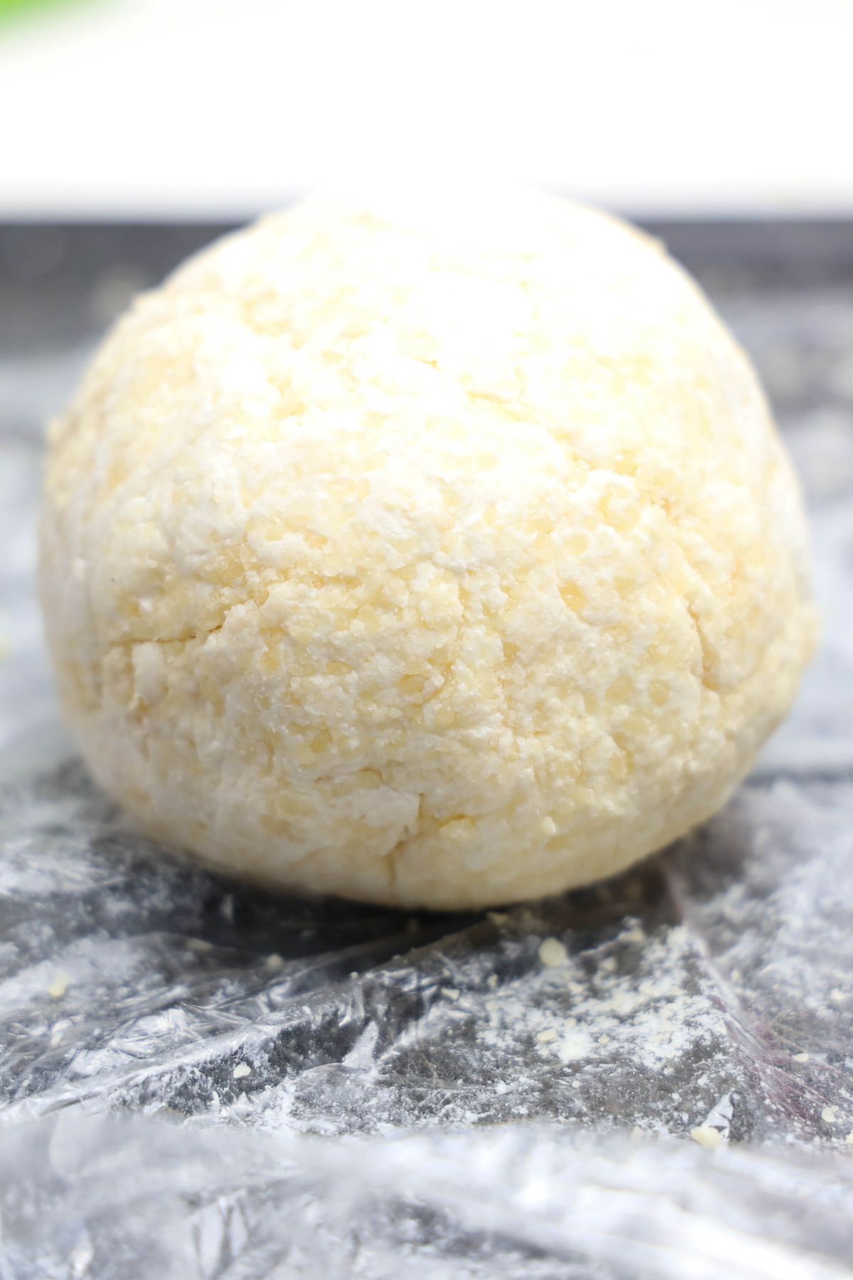 Cheeseball on saran wrap.