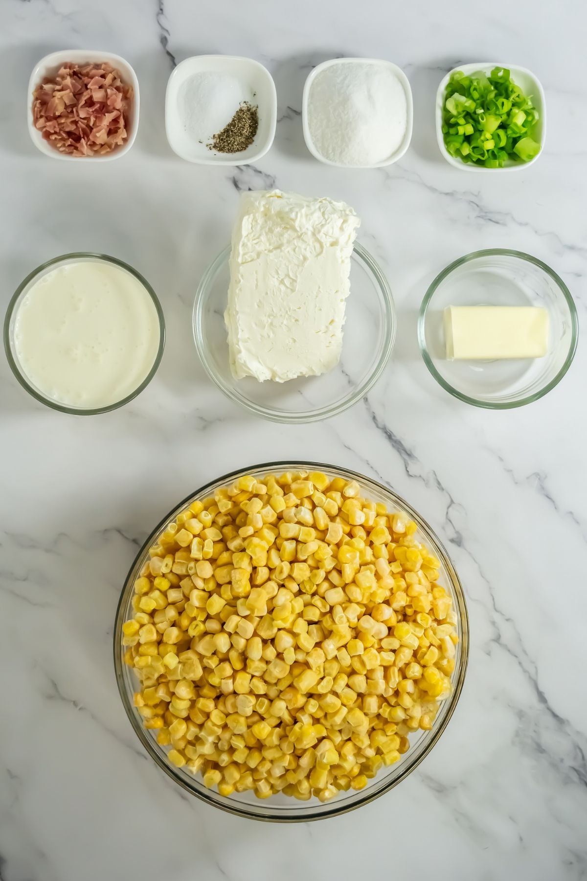 Creamed corn ingredients on a marble counter.