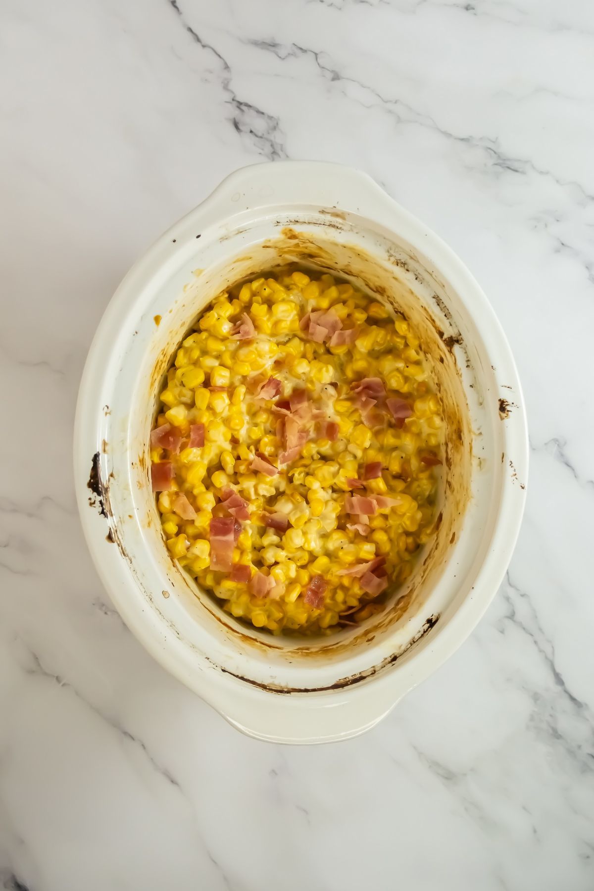 Creamed corn with bacon on top.