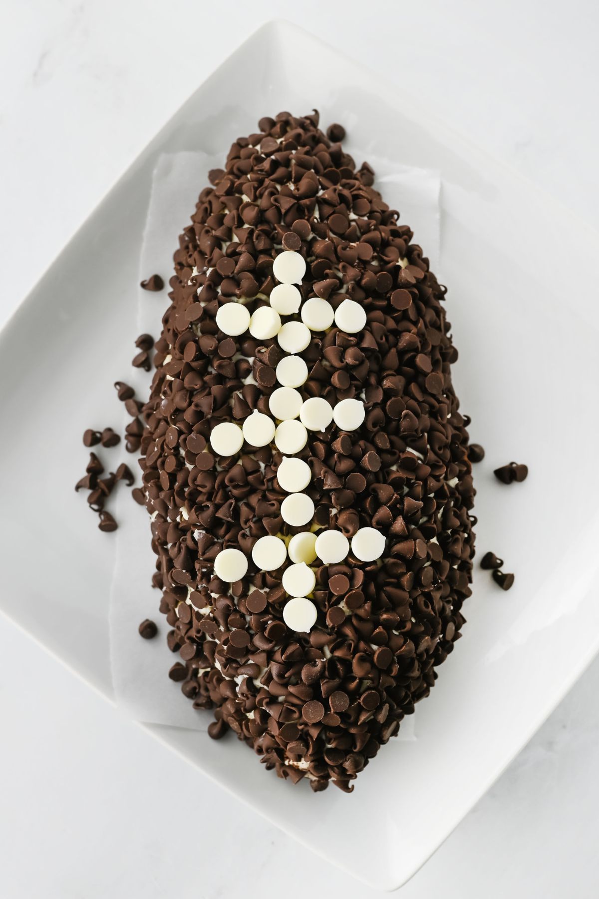 Chocolate chips pressed into cheeseball.