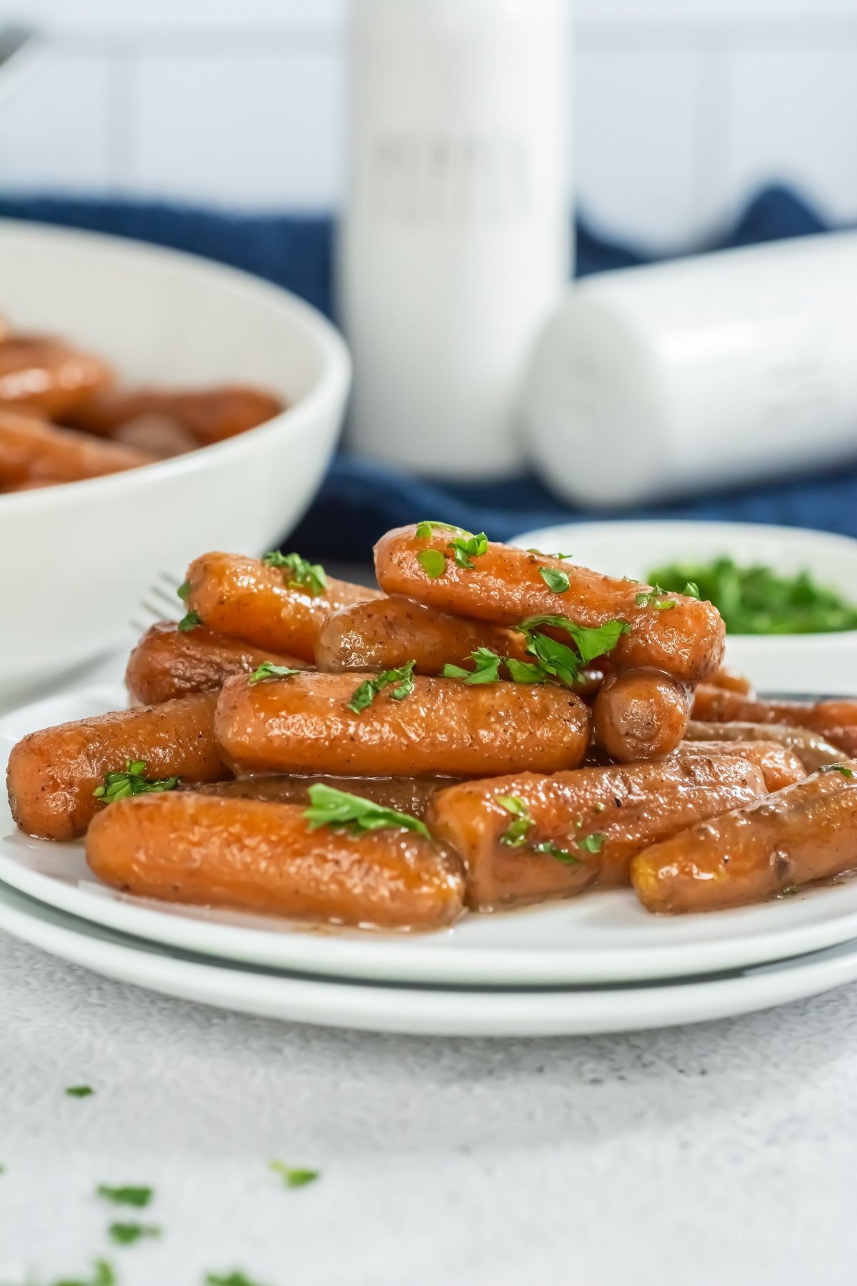 Glazed carrots on a white plate.