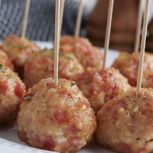 Ham meatballs on a white plate.