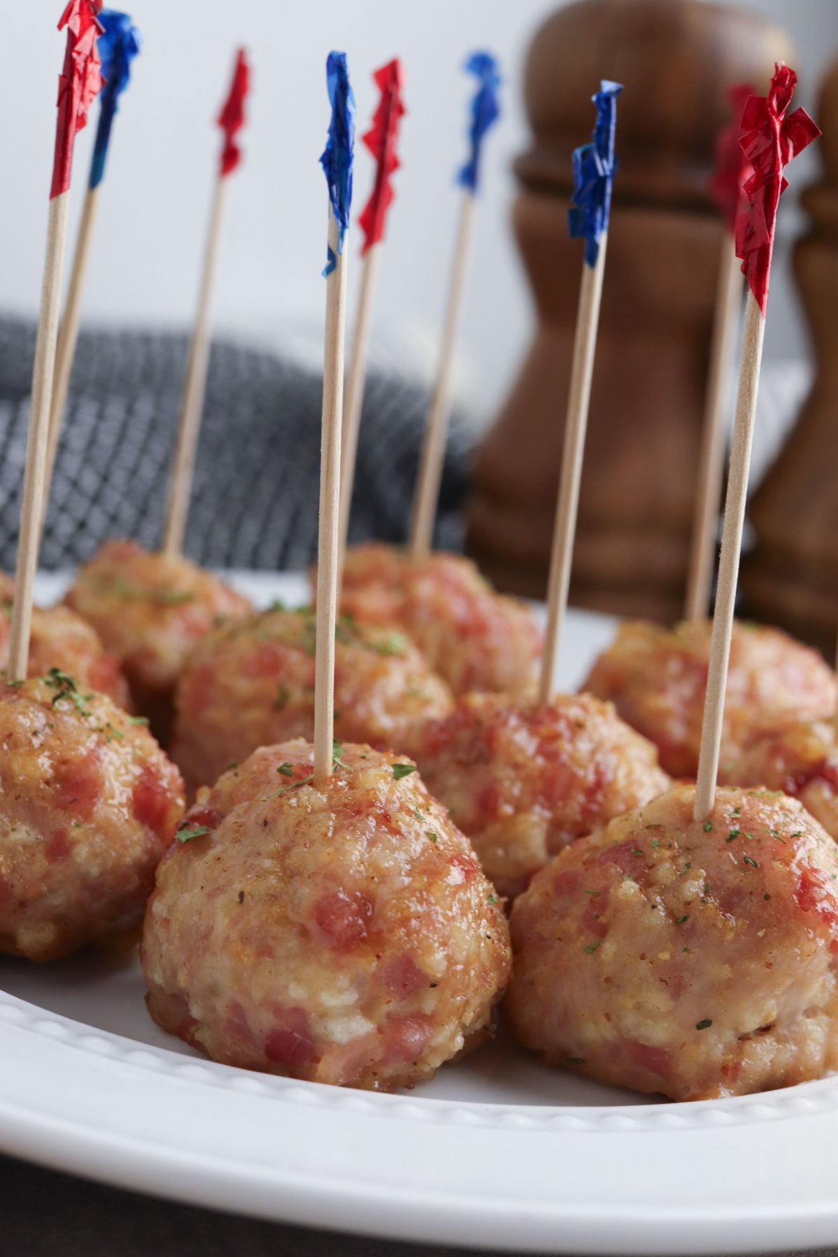 Ham meatballs on a white plate.