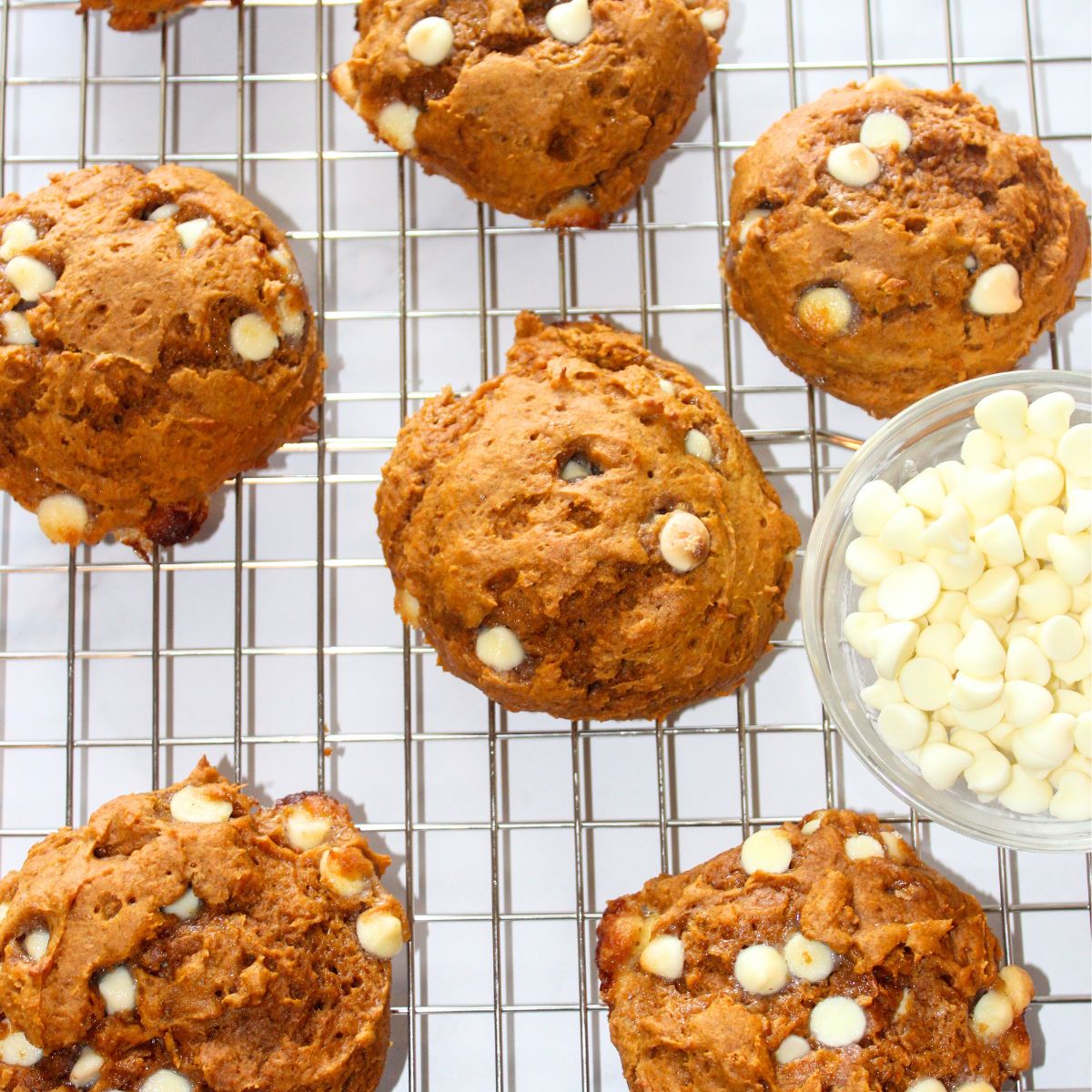 Pumpkin spice cake mix cookies on cooling rack.