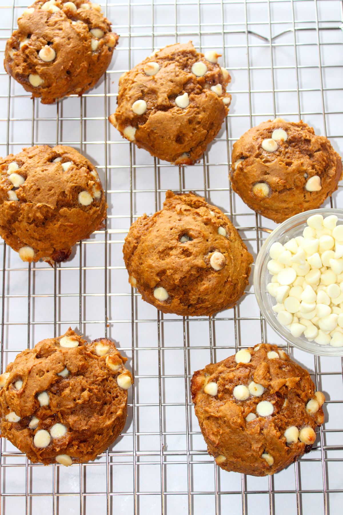 Pumpkin spice cake mix cookies on cooling rack.