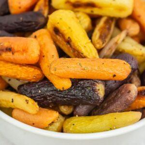 Roasted carrots in a white bowl.