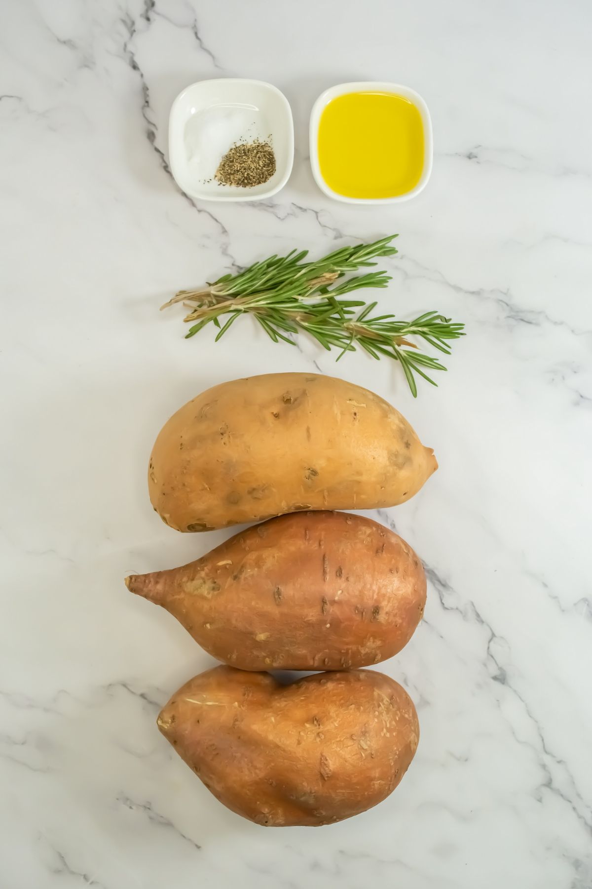 Sliced sweet potato ingredients on a marble counter.