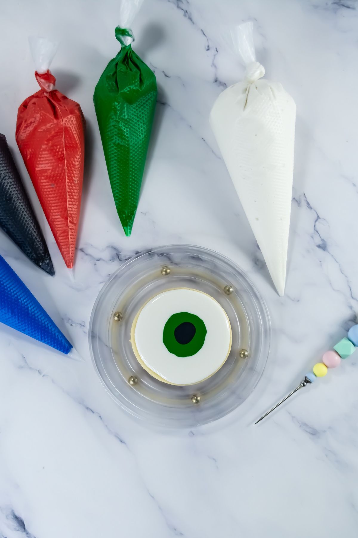 Cookie being decorated with icing.
