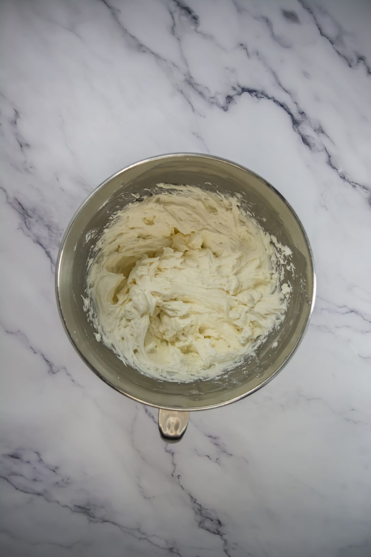 Whipped icing in bowl.