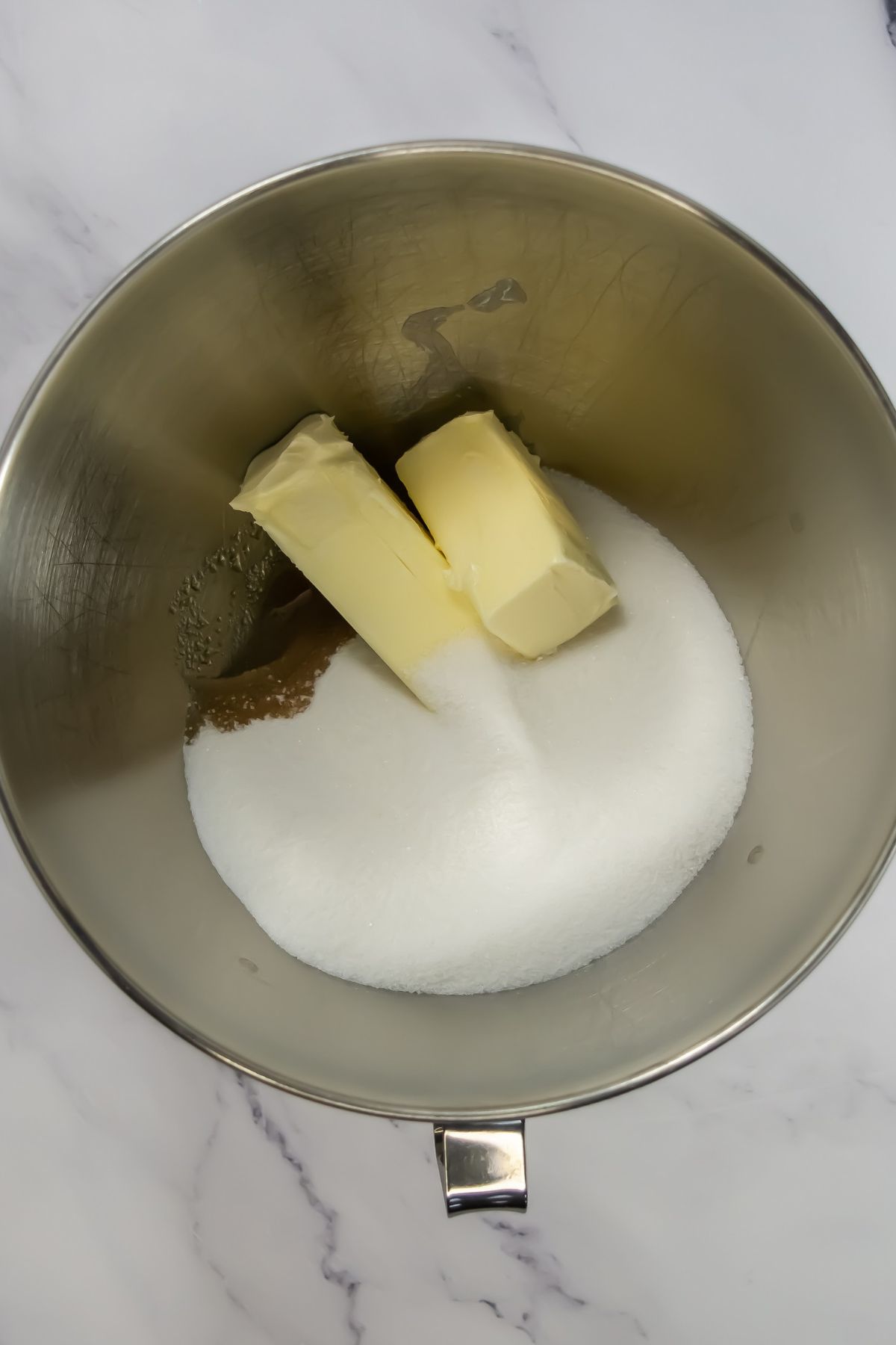 Butter and sugar in bowl.