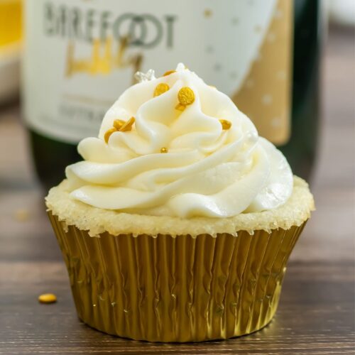 Champagne cupcake on wooden table.