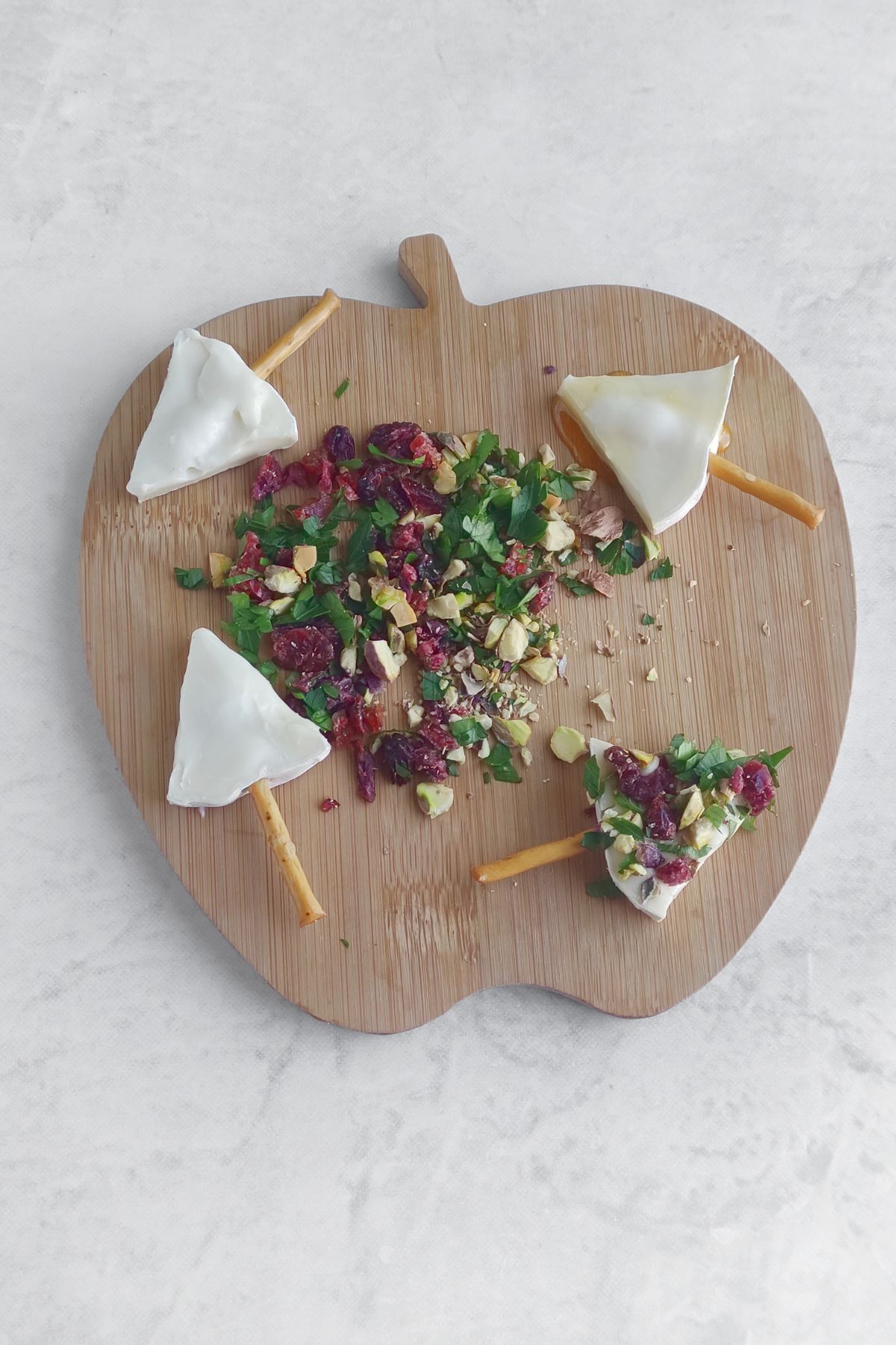 Making christmas tree brie bites.