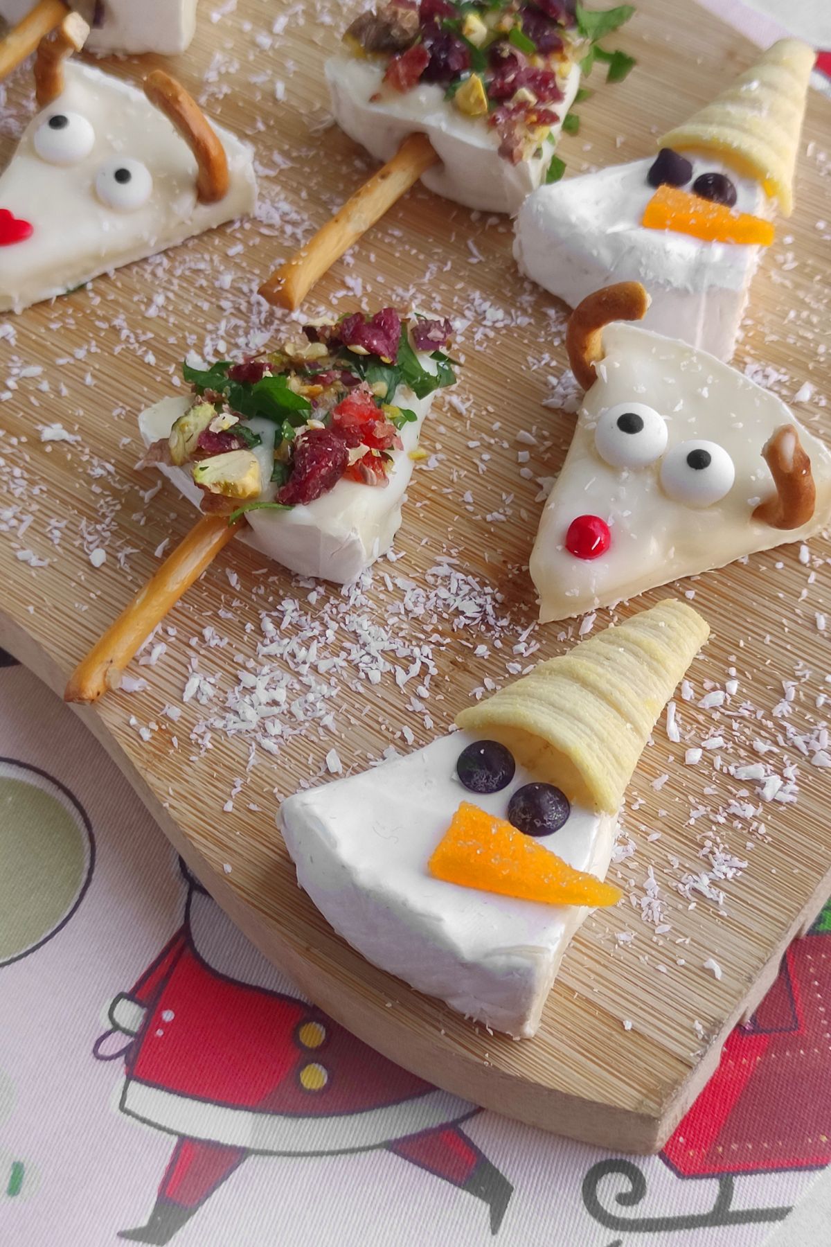 Christmas brie bites on a cutting board.