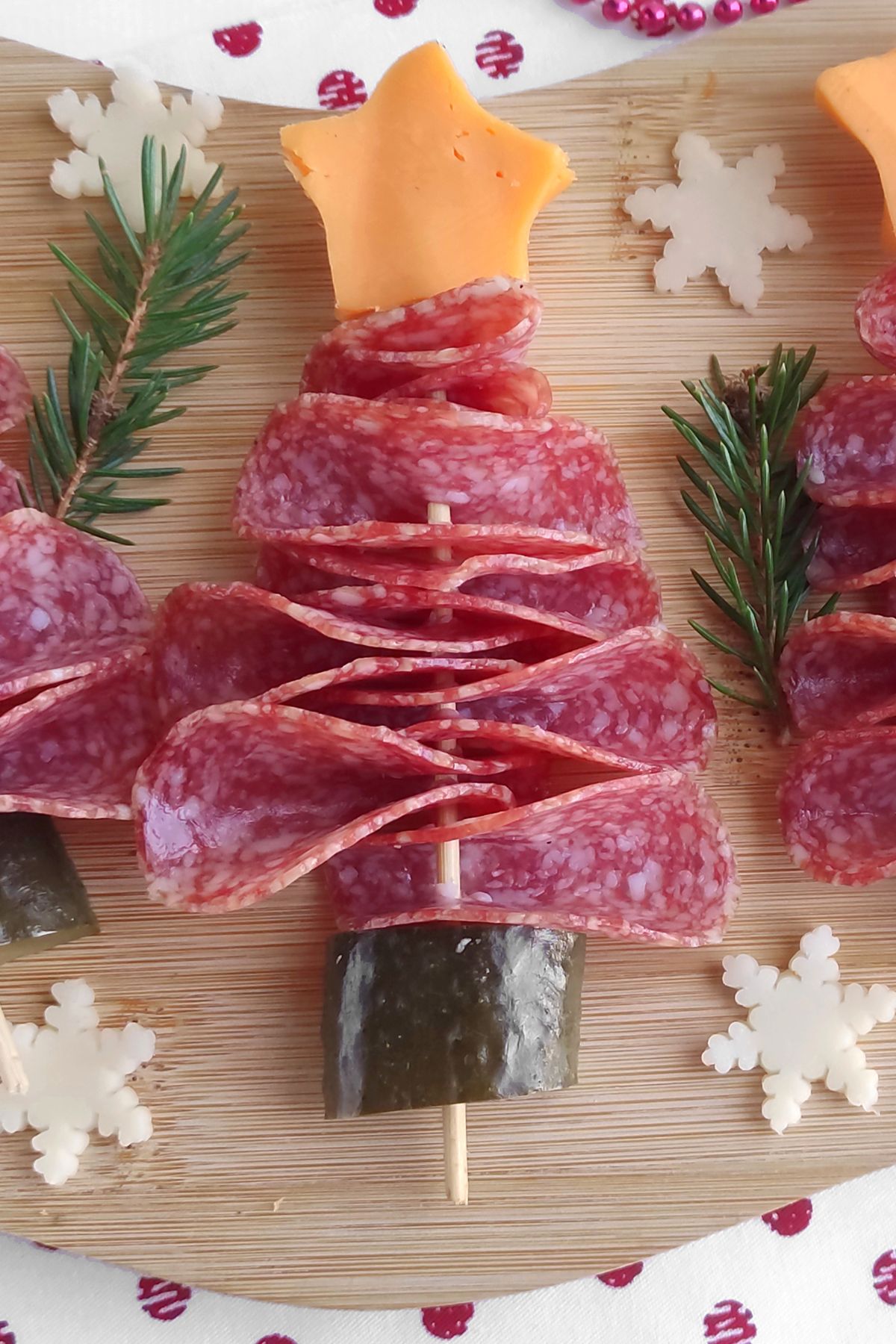 Salami christmas tree appetizers on a cutting board.