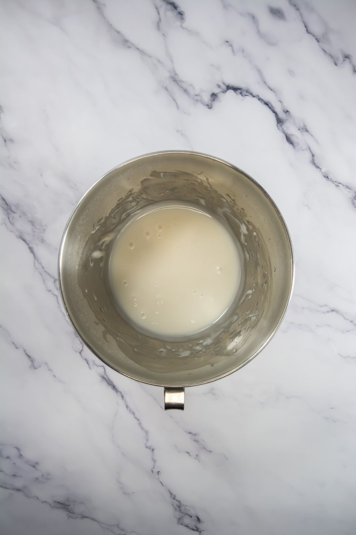 Mixing icing in a bowl.