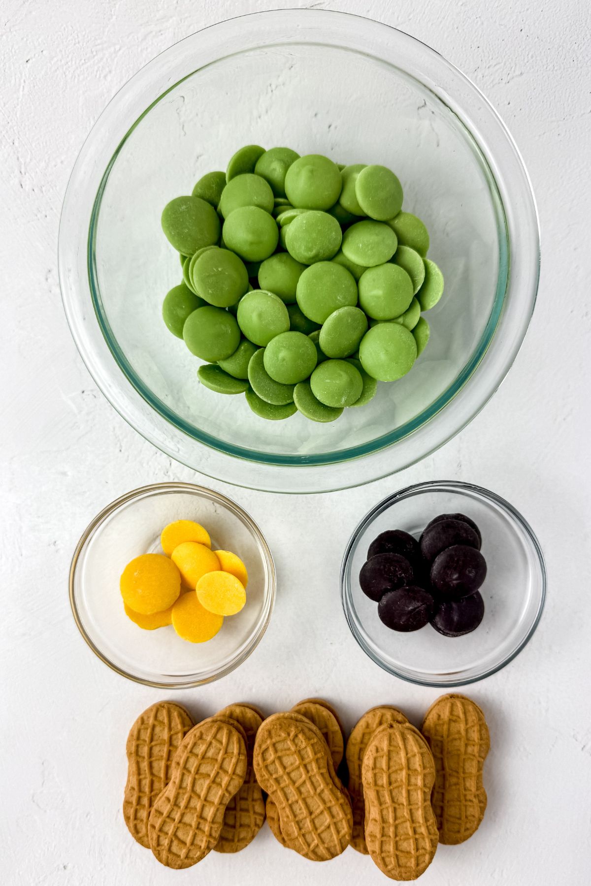 Grinch nutter butter ingredients on a white table.